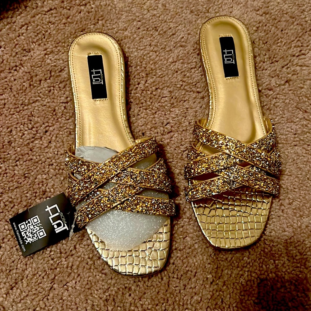 Hello. I am selling a beautiful pair of sparkling gold sandals with silver.